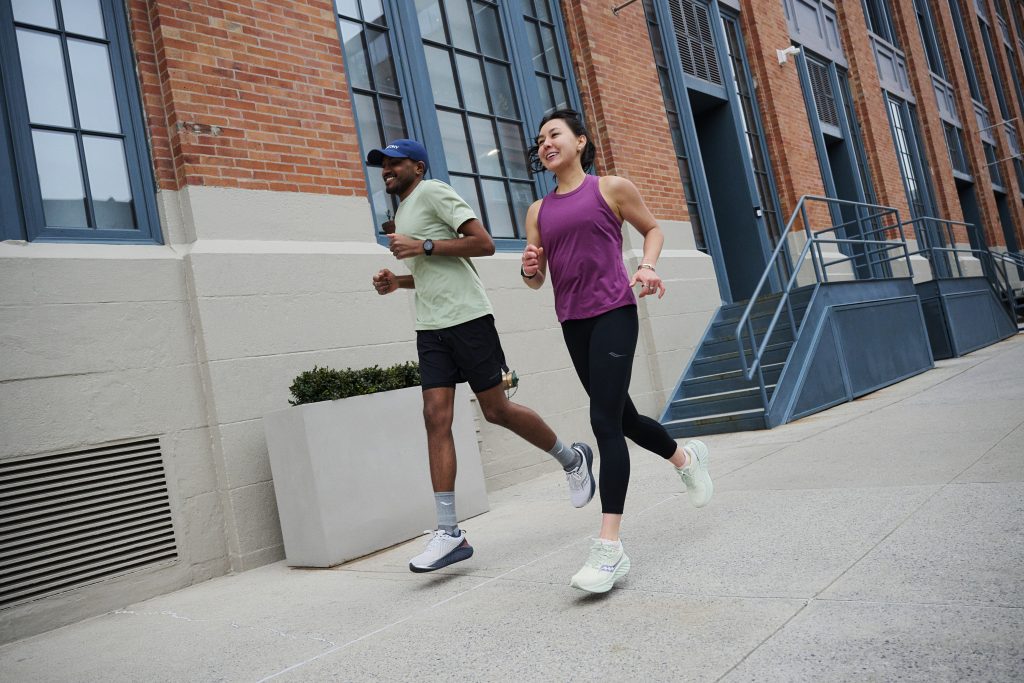 man and woman running in saucony triumph 22