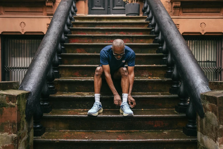 Man tying his shoes getting ready to run