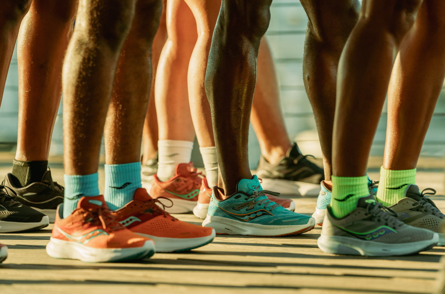 Group of runners wearing Saucony Ride 16 and Saucony Guide 16 running shoes